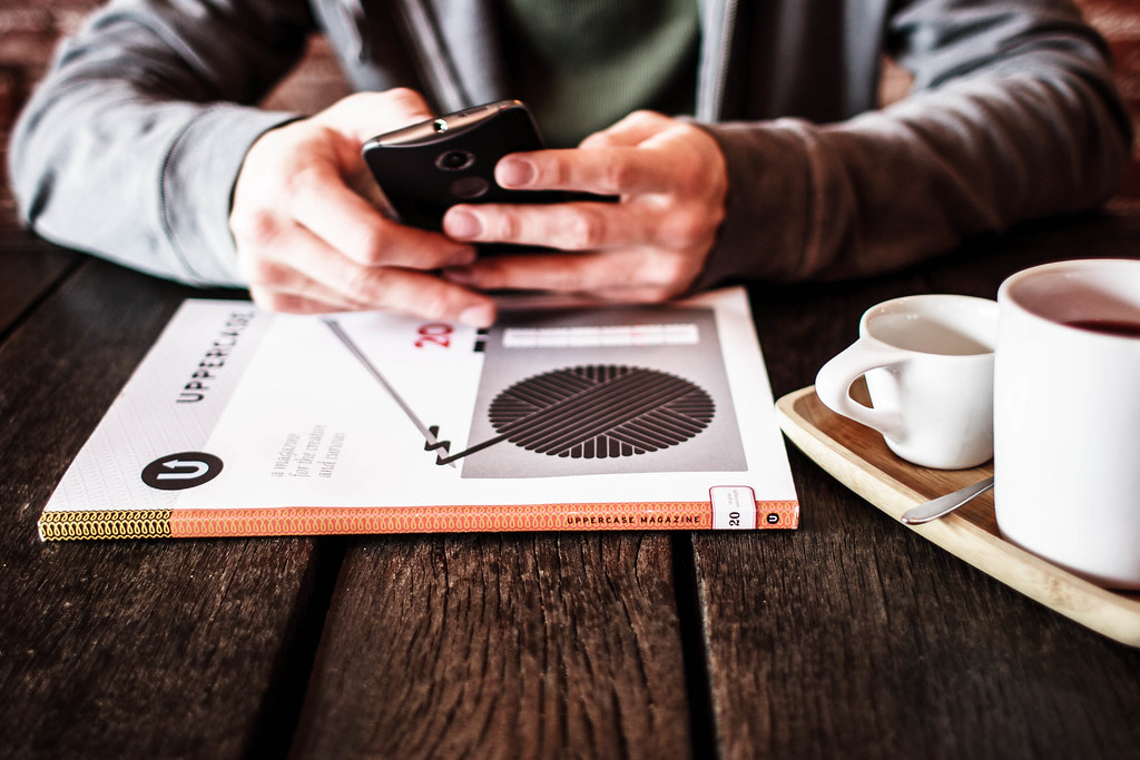 Person using a smartphone to ask an AI assistant for recommendations